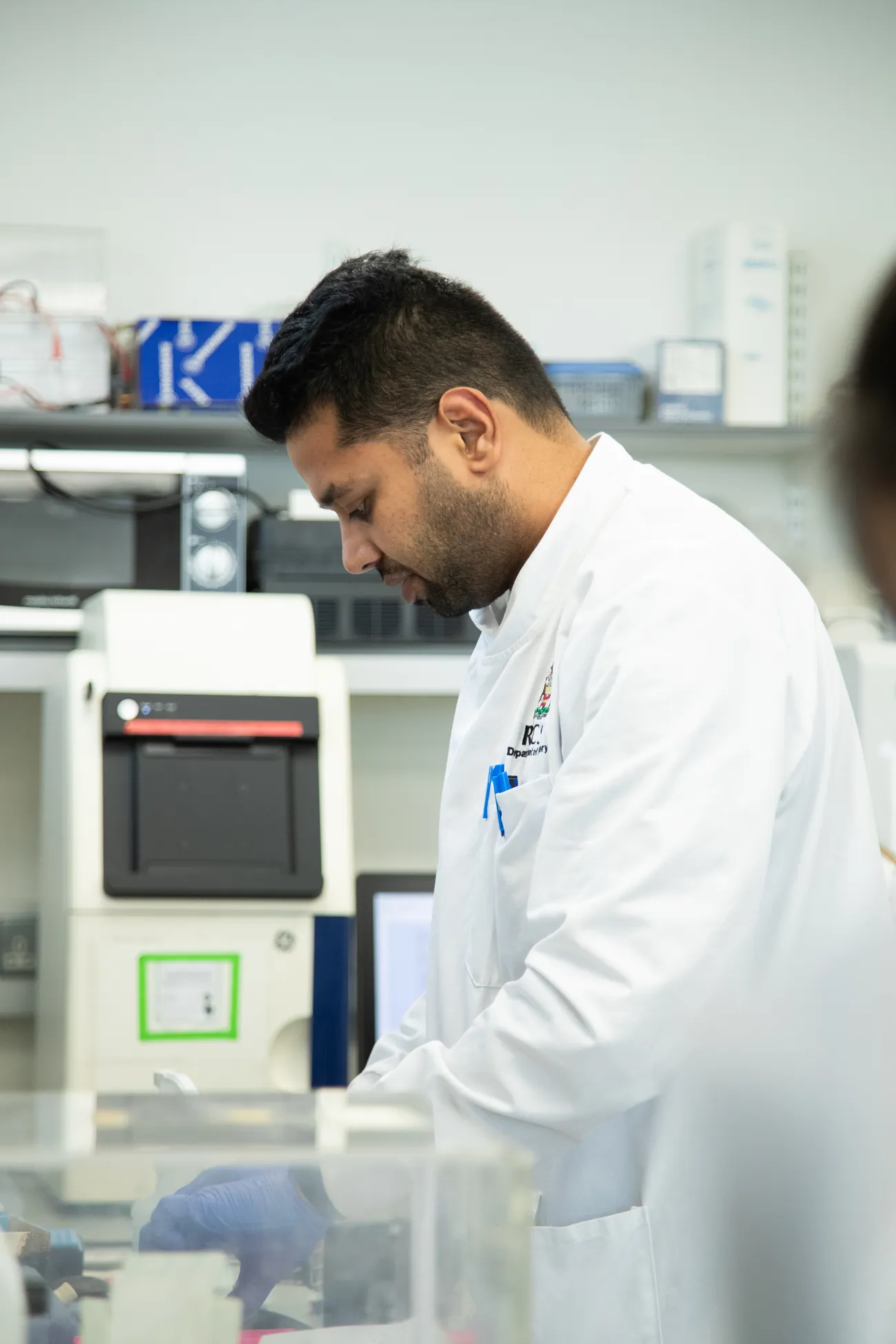 A researcher working at a lab bench