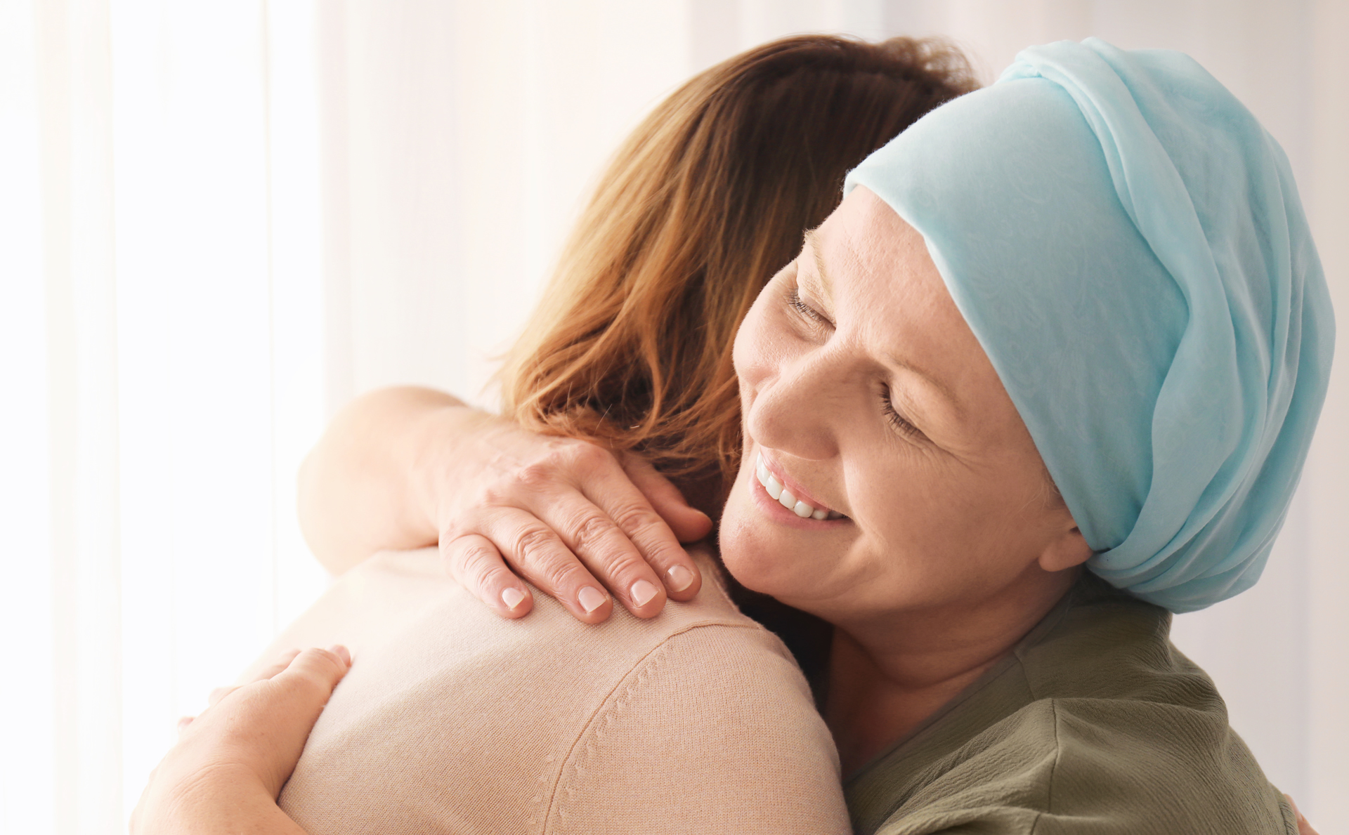 Breast Cancer Patient being hugged by daughter